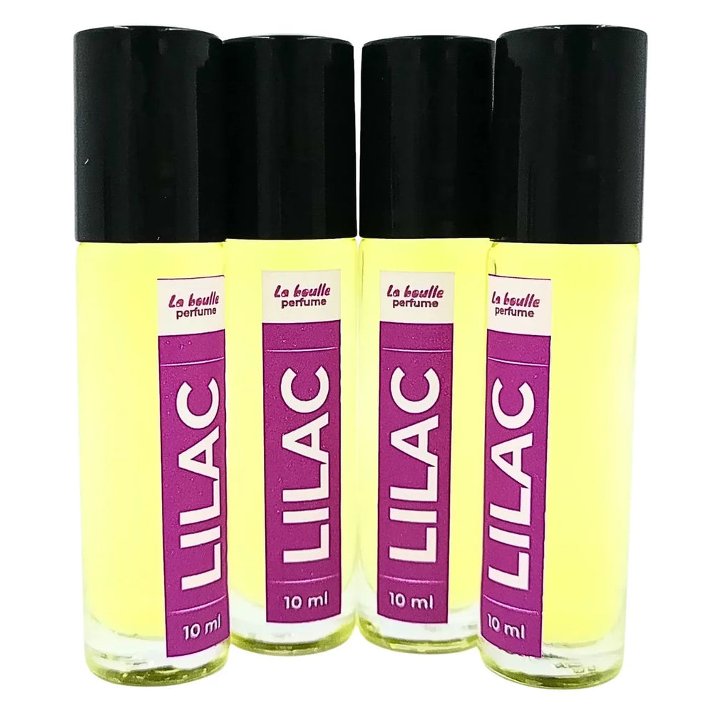 Lilac roll-on perfume bottles La Boulle with black caps on a white background