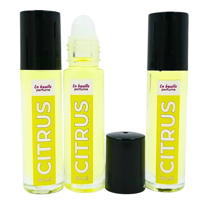 Three bottles of Citrus perfume by 'La Boulle' on a white background
