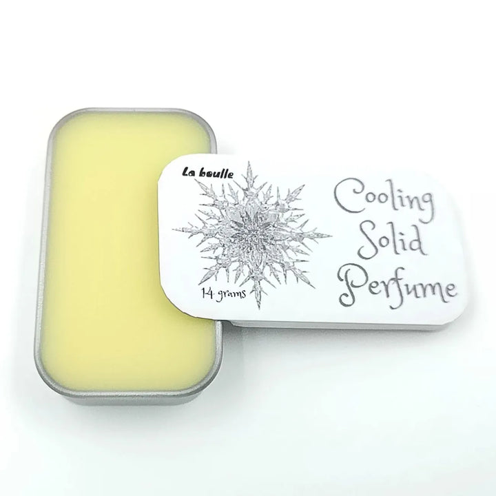 Cooling solid natural perfume balm, La Boulle, on a white background