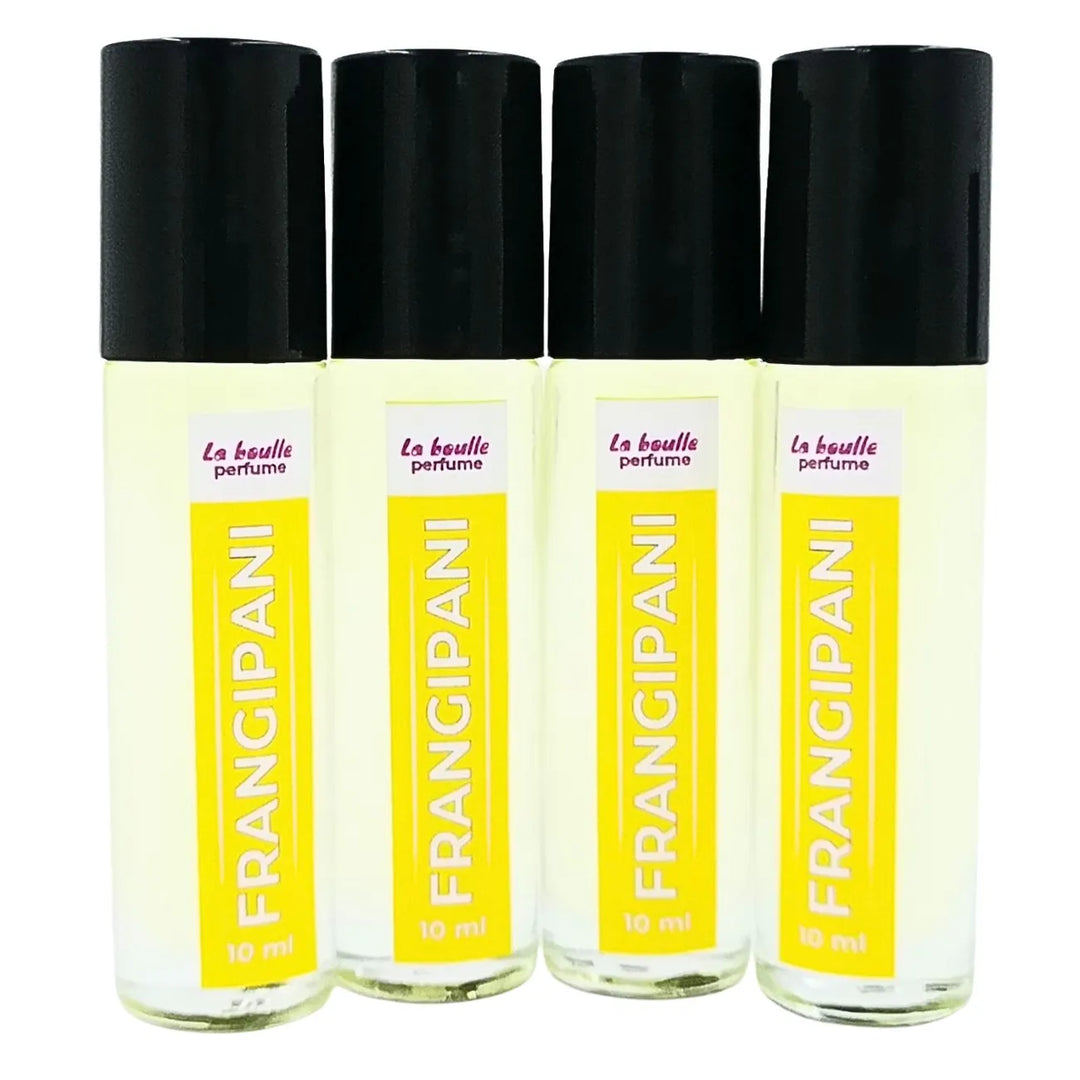 Set of four Frangipani perfume roll-on bottles La Boulle with yellow labels and black caps on a white background