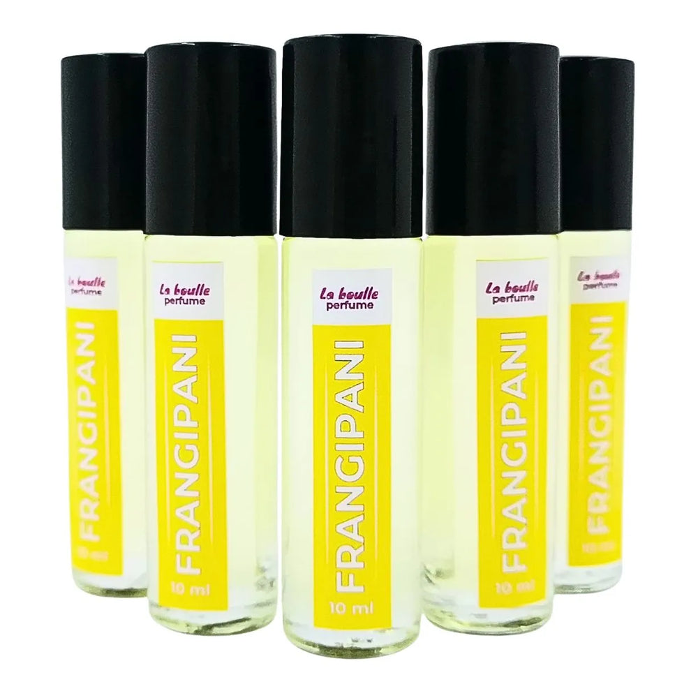 Set of five Frangipani perfume roll-on bottles La Boulle with yellow labels and black caps on a white background