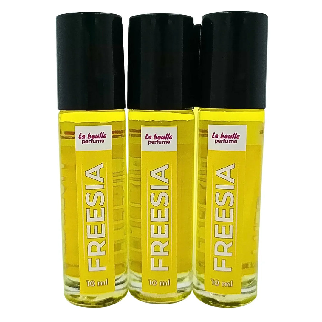 Freesia roll-on perfume bottles La Boulle with black caps on a white background