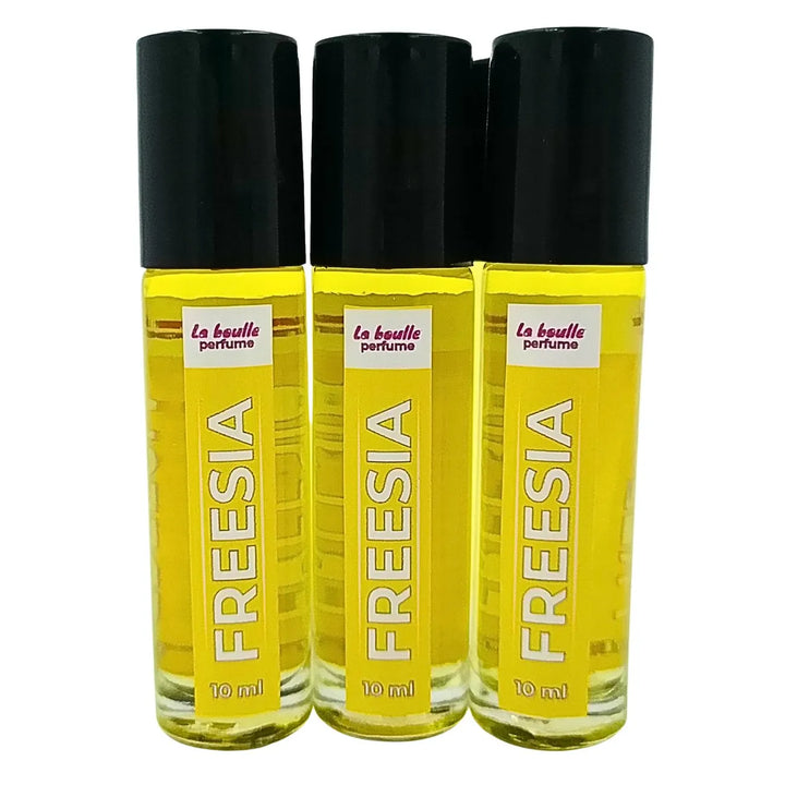 Freesia roll-on perfume bottles La Boulle with black caps on a white background