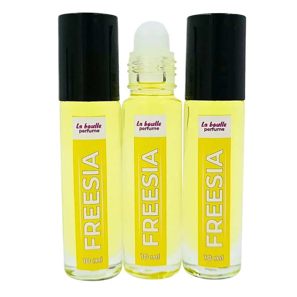Freesia roll-on perfume bottles La Boulle with black caps on a white background