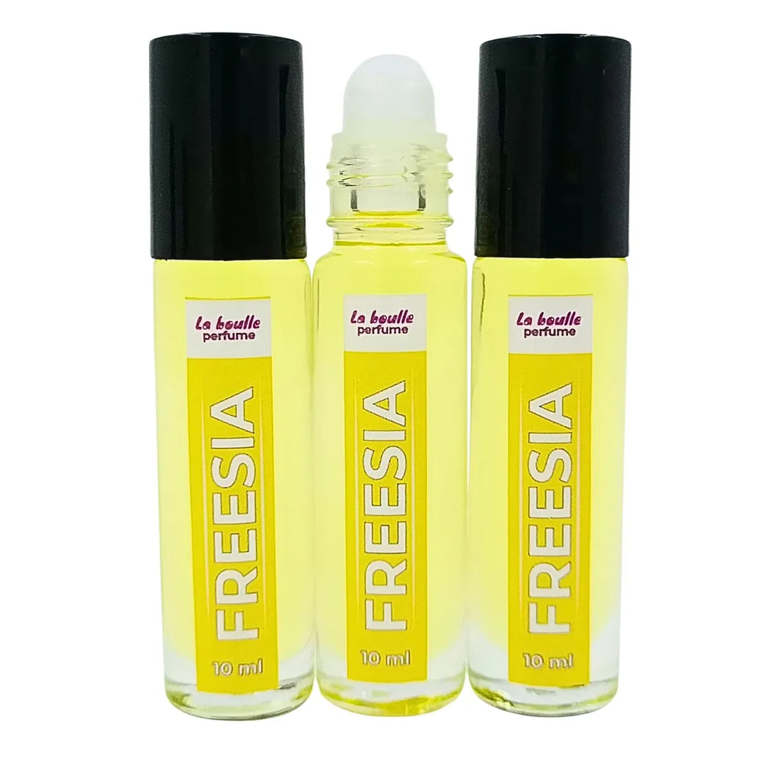 Freesia roll-on perfume bottles La Boulle with black caps on a white background
