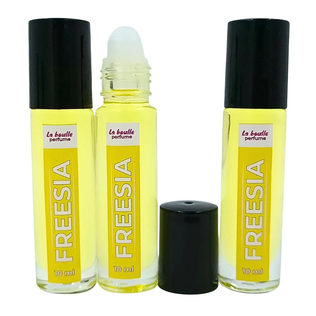 Freesia roll-on perfume bottles La Boulle with black caps on a white background