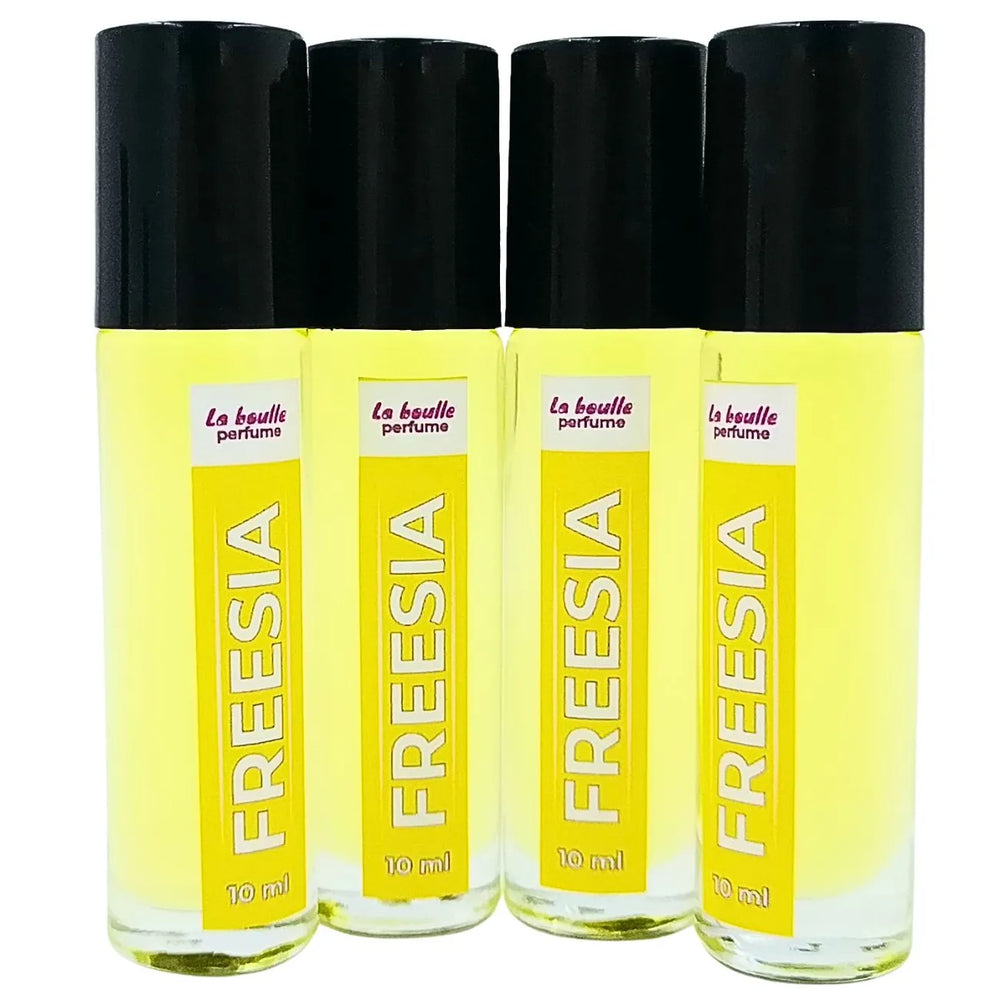 Freesia roll-on perfume bottles La Boulle with black caps on a white background