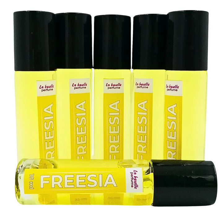 Freesia roll-on perfume bottles La Boulle with black caps on a white background