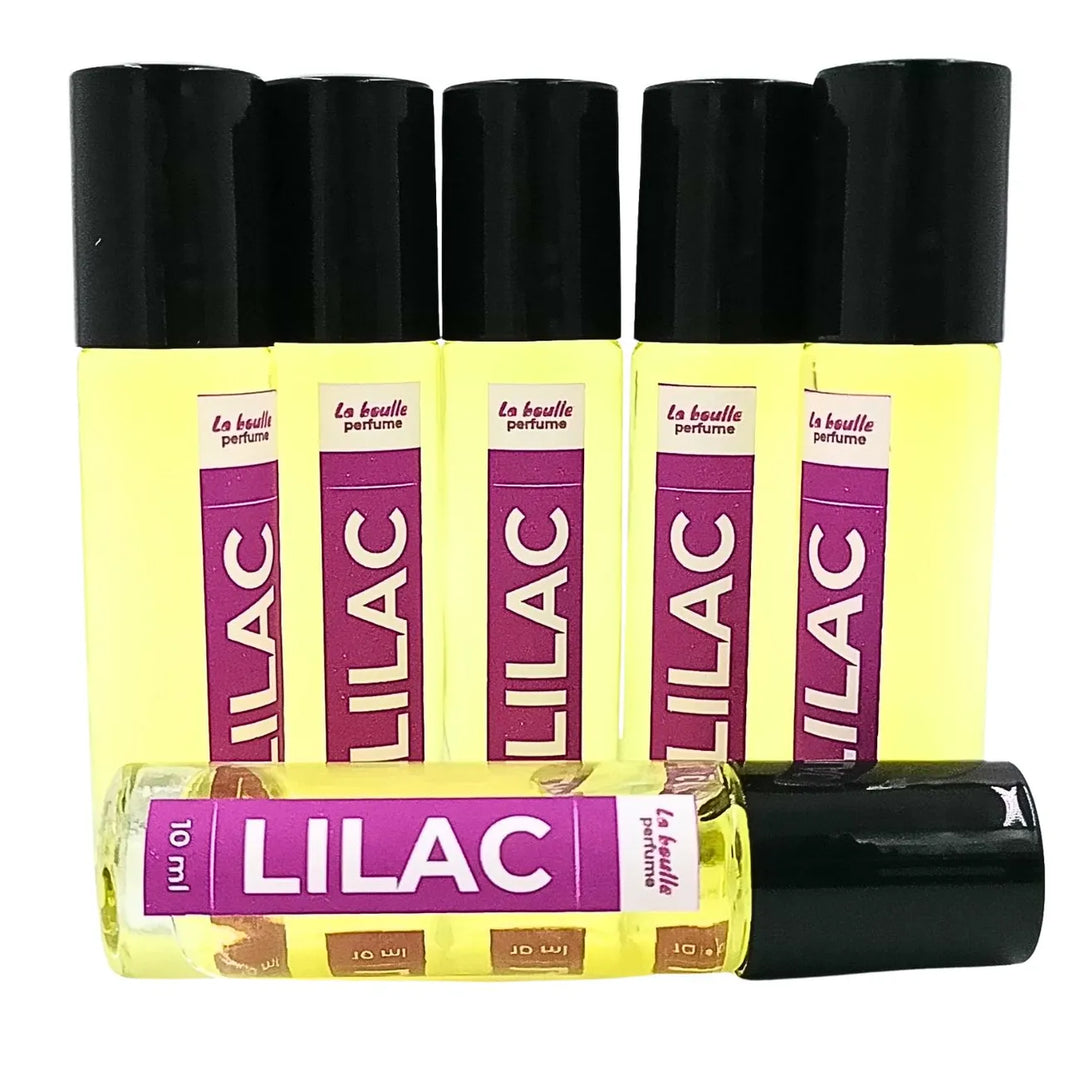 Lilac roll-on perfume bottles La Boulle with black caps on a white background