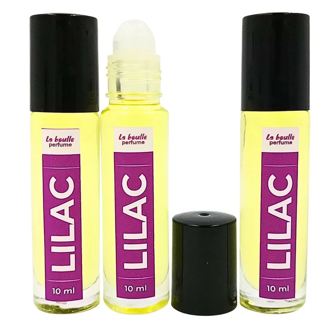 Lilac roll-on perfume bottles La Boulle with black caps on a white background