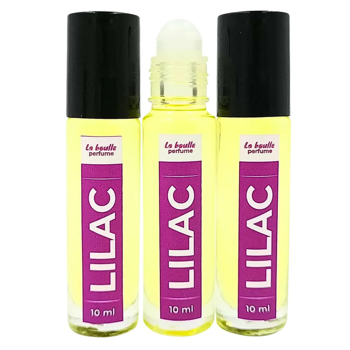 Lilac roll-on perfume bottles La Boulle with black caps on a white background