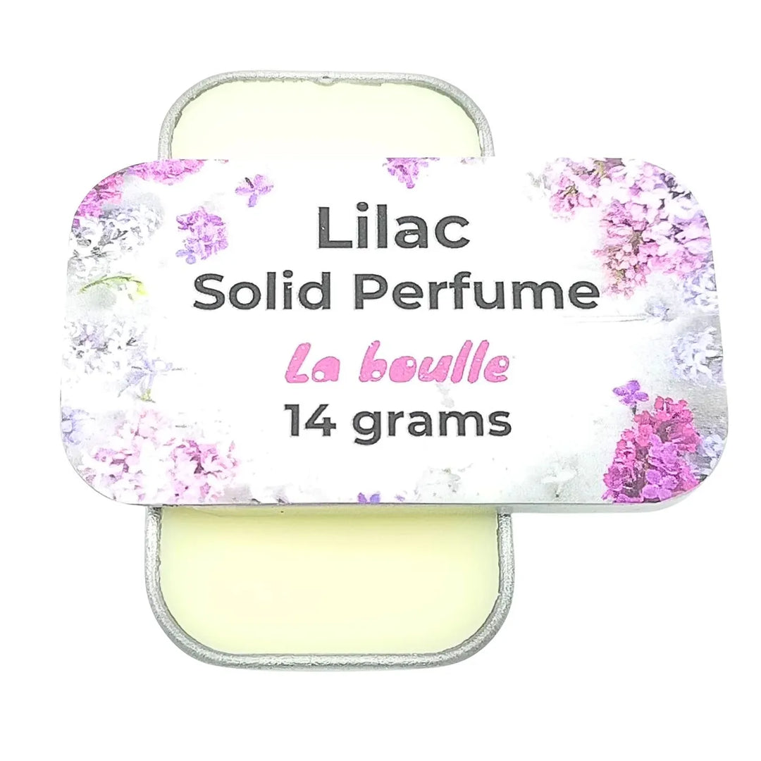 Lilac solid natural perfume balm, La Boulle, on a white background