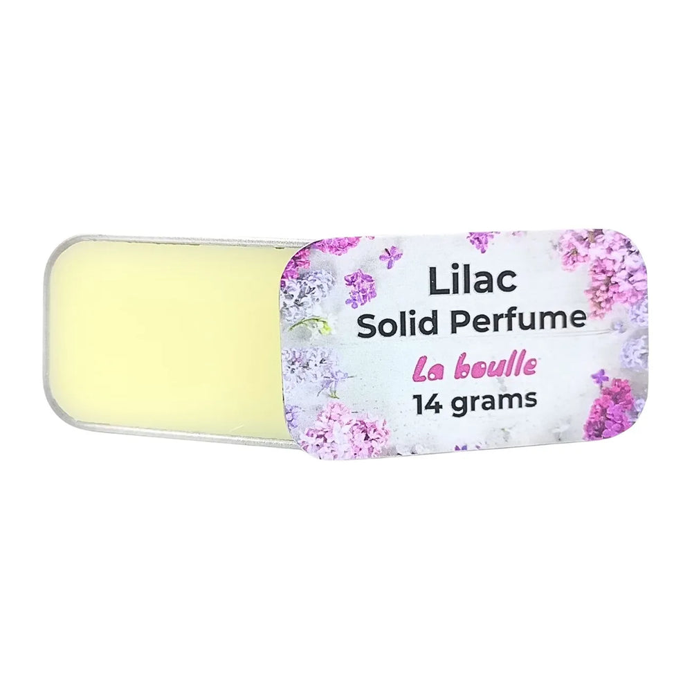 Lilac solid natural perfume balm, La Boulle, on a white background
