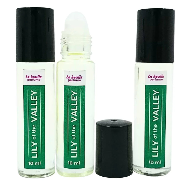 Lily of the valley roll-on perfume bottles La Boulle with black caps on a white background