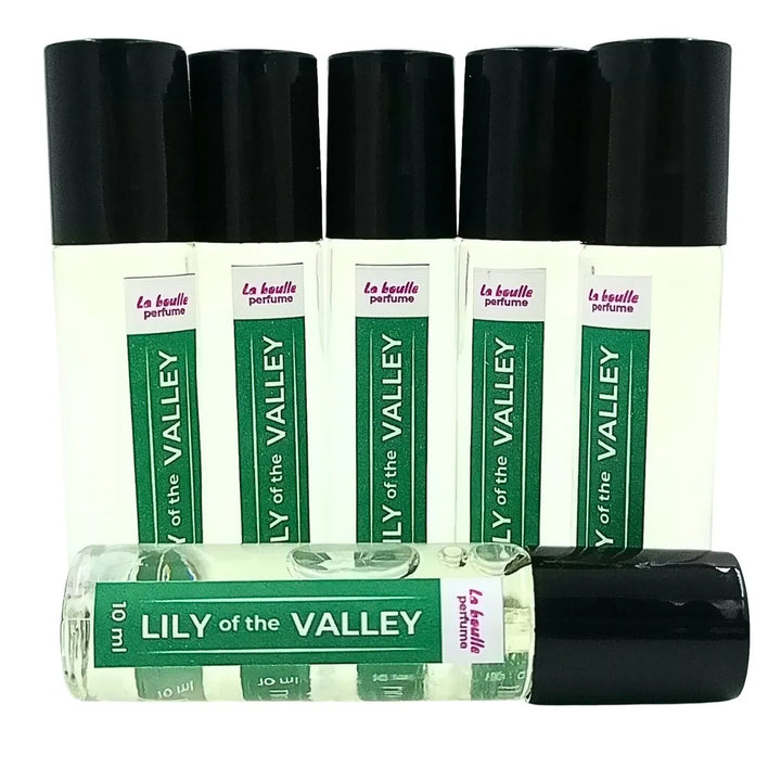 Lily of the valley roll-on perfume bottles La Boulle with black caps on a white background