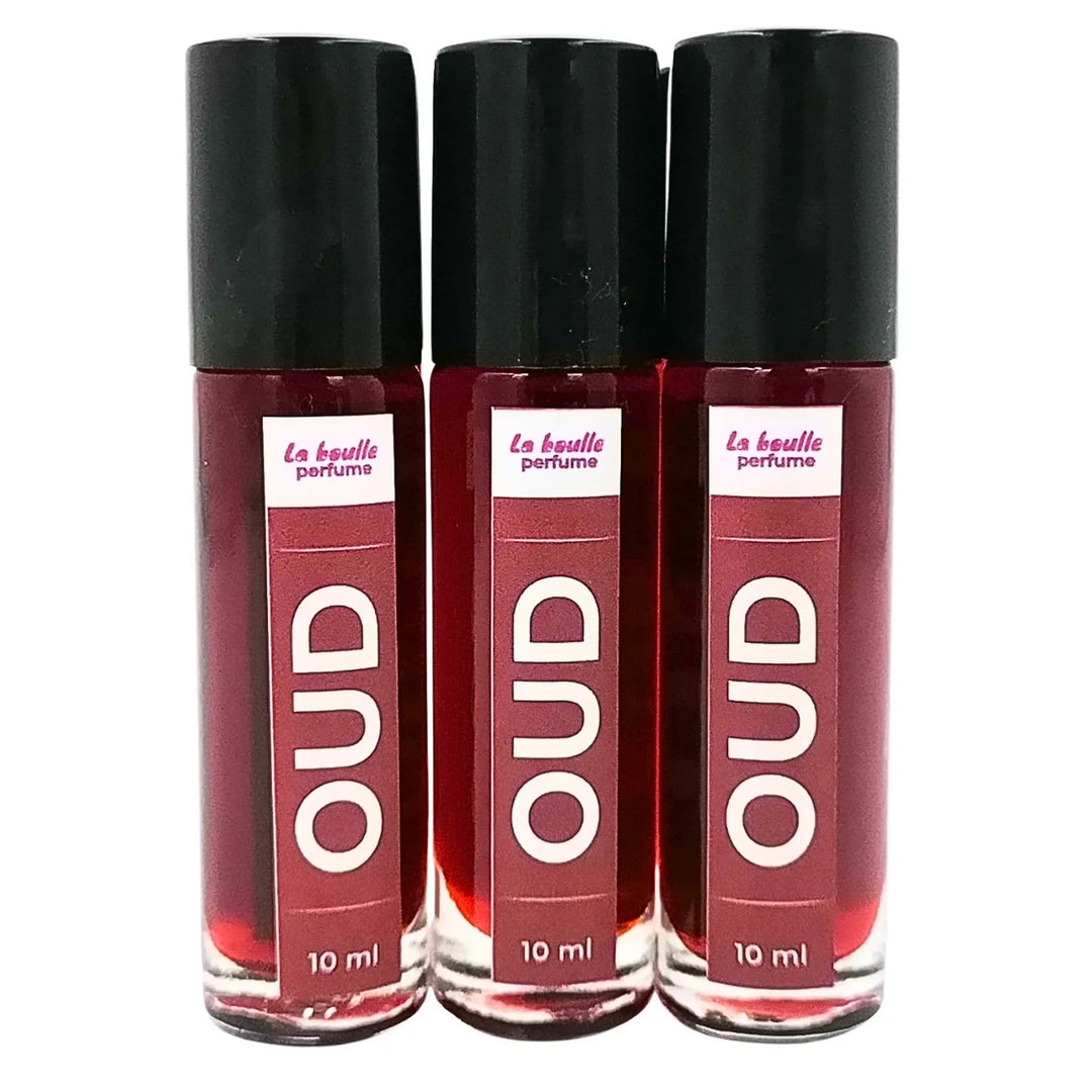 Oud roll-on perfume bottles La Boulle with black caps on a white background