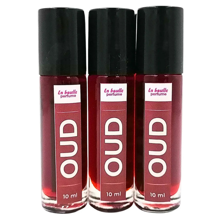Oud roll-on perfume bottles La Boulle with black caps on a white background