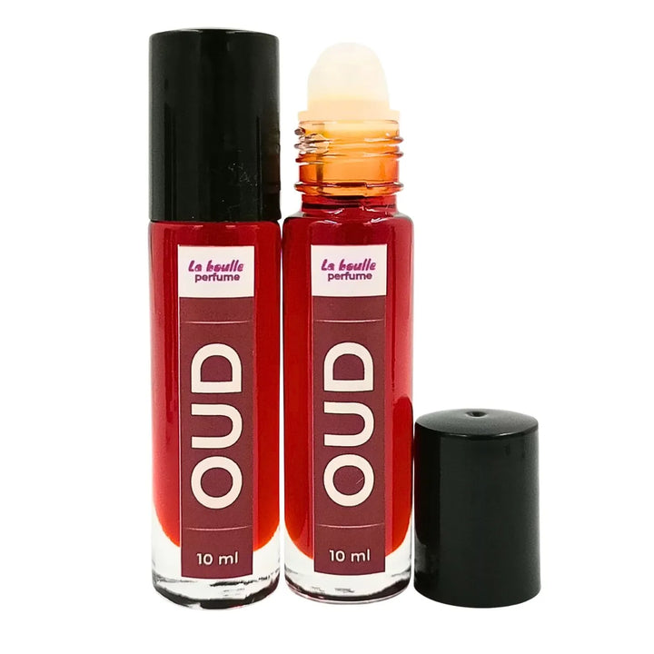 Oud roll-on perfume bottles La Boulle with black caps on a white background