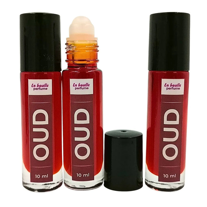Oud roll-on perfume bottles La Boulle with black caps on a white background