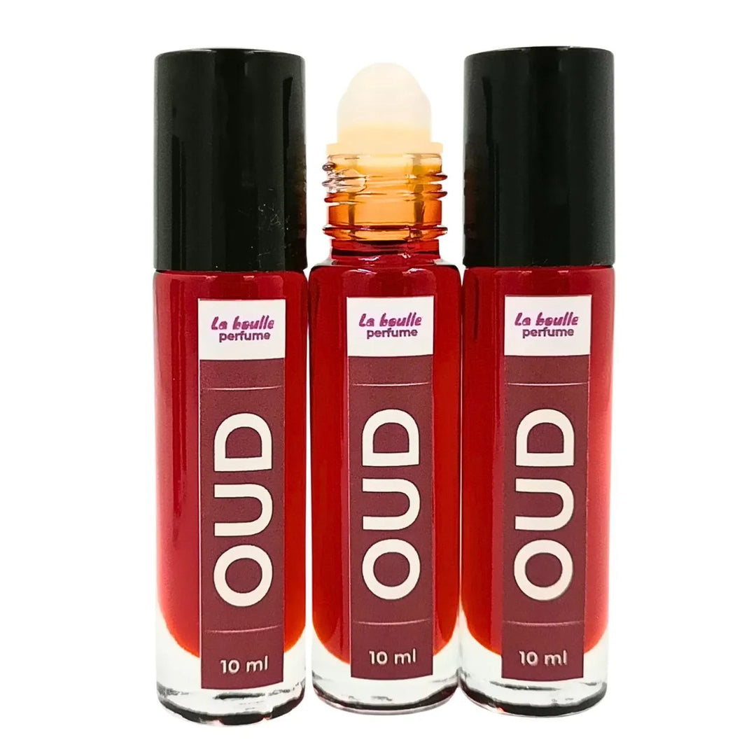 Oud roll-on perfume bottles La Boulle with black caps on a white background