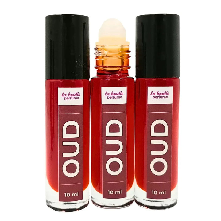Oud roll-on perfume bottles La Boulle with black caps on a white background