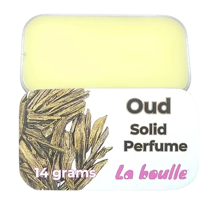 Oud solid natural perfume balm, La Boulle, on a white background
