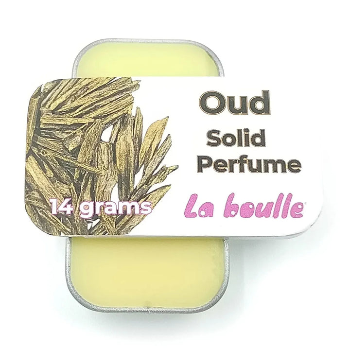 Oud solid natural perfume balm, La Boulle, on a white background