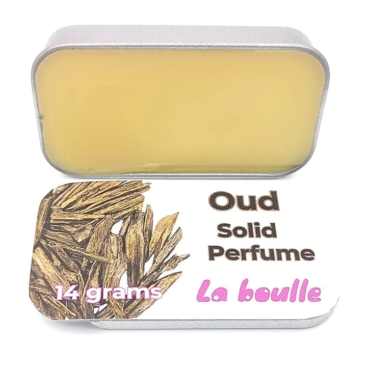 Oud solid natural perfume balm, La Boulle, on a white background