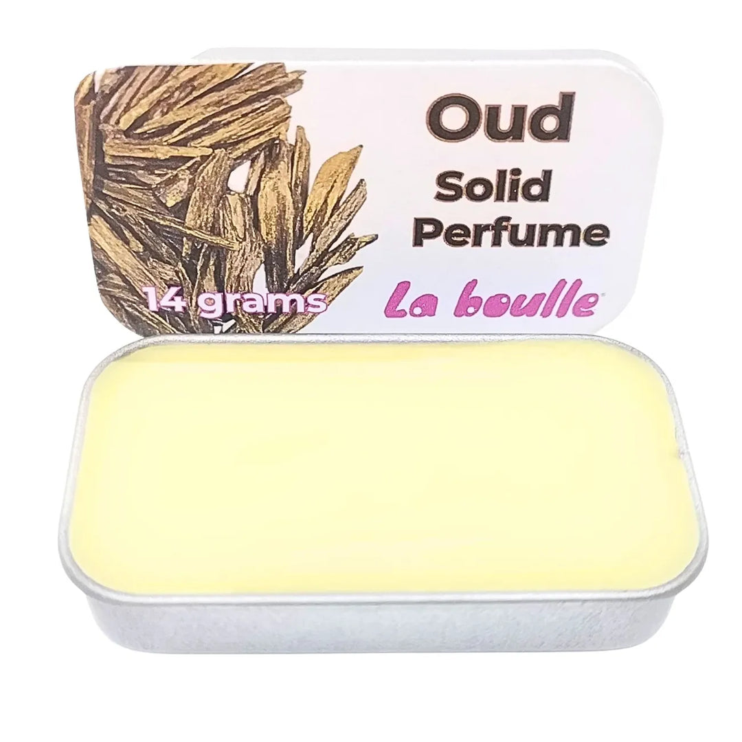 Oud solid natural perfume balm, La Boulle, on a white background