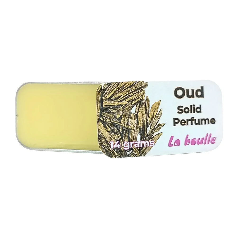 Oud solid natural perfume balm, La Boulle, on a white background