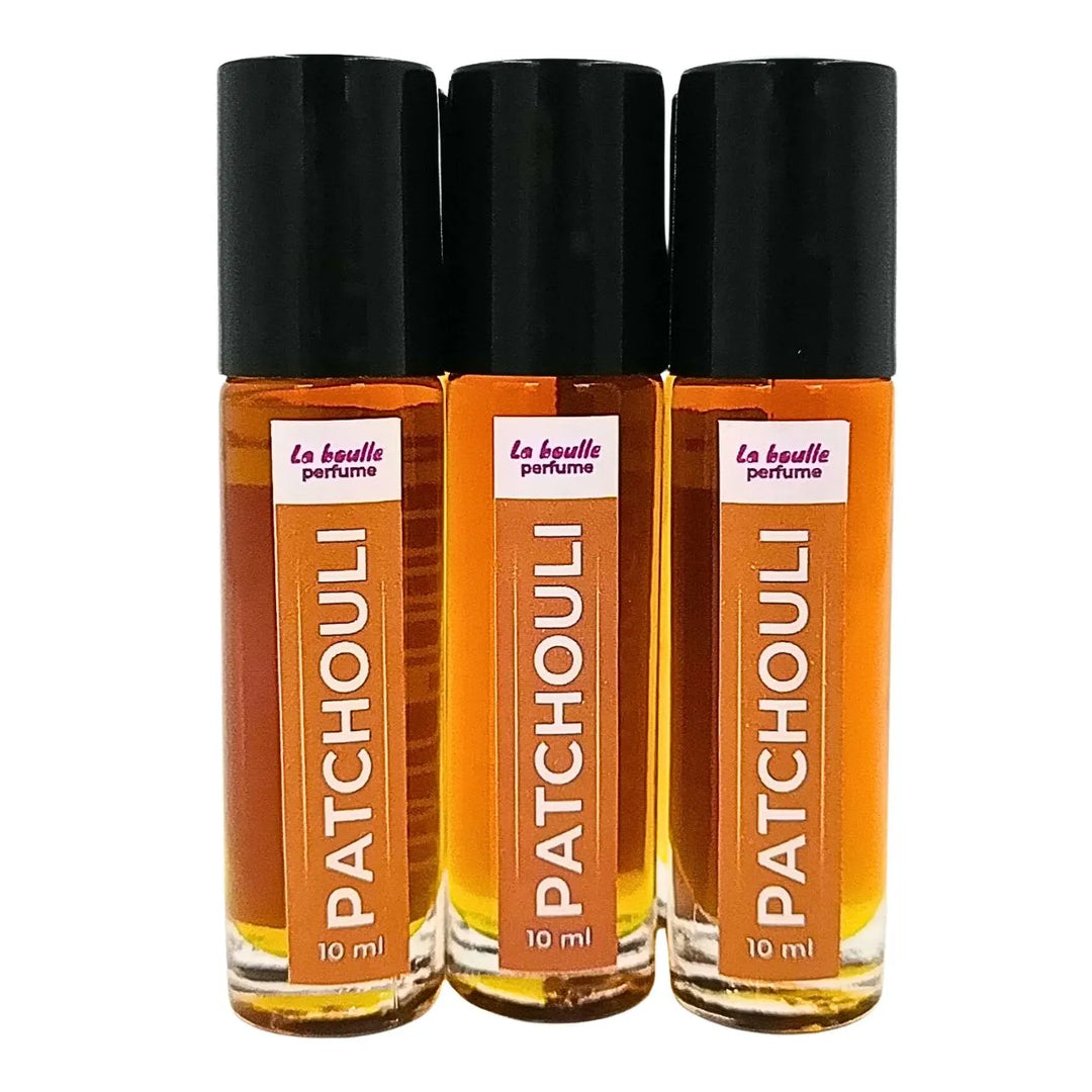 Patchouli roll-on perfume bottles La Boulle with black caps on a white background