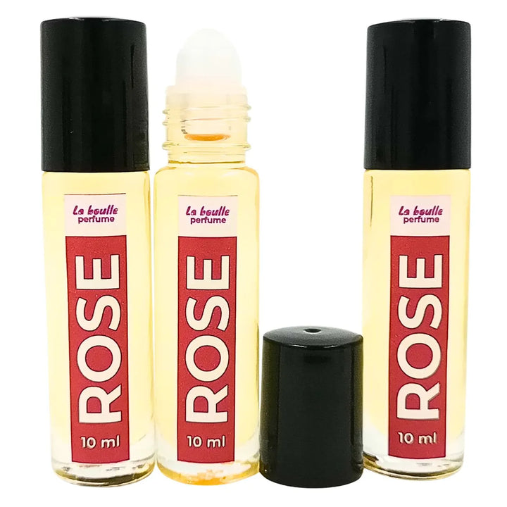 Rose roll-on perfume bottles La Boulle with black caps on a white background