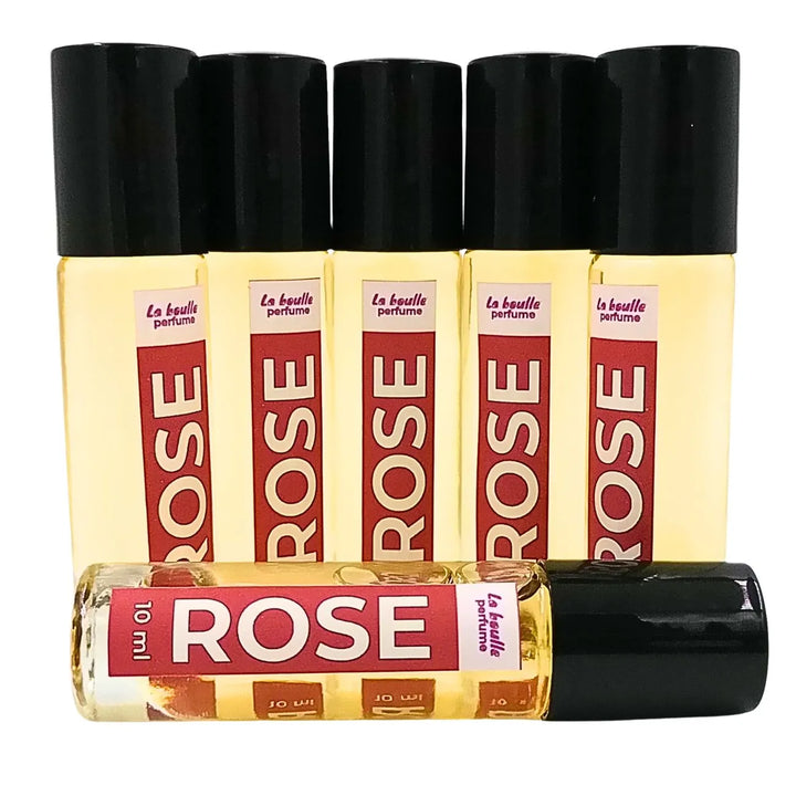 Rose roll-on perfume bottles La Boulle with black caps on a white background