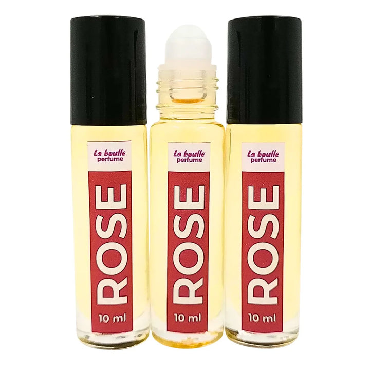 Rose roll-on perfume bottles La Boulle with black caps on a white background