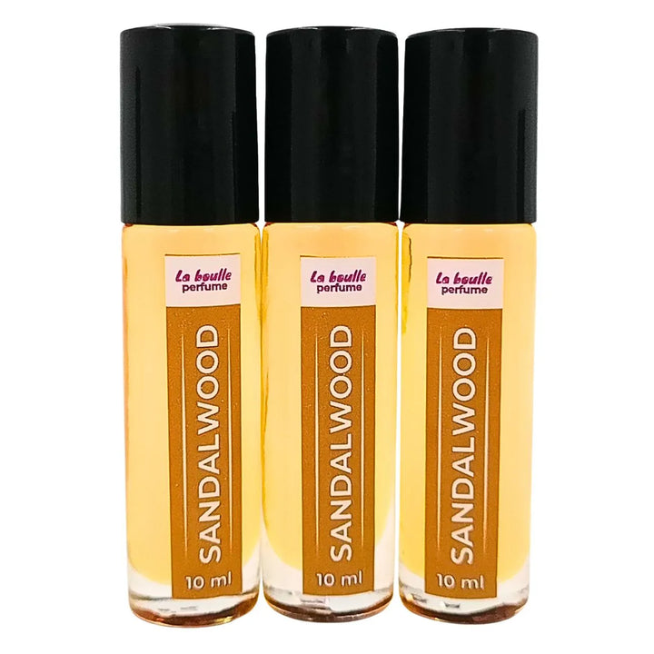 Sandalwood roll-on perfume bottles La Boulle with black caps on a white background