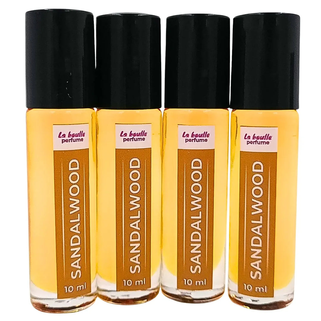 Sandalwood roll-on perfume bottles La Boulle with black caps on a white background