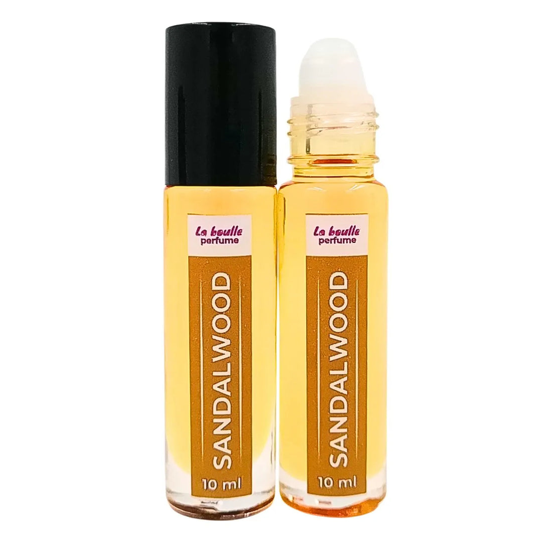 Sandalwood roll-on perfume bottles La Boulle with black caps on a white background