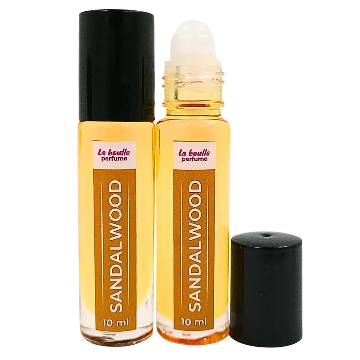 Sandalwood roll-on perfume bottles La Boulle with black caps on a white background